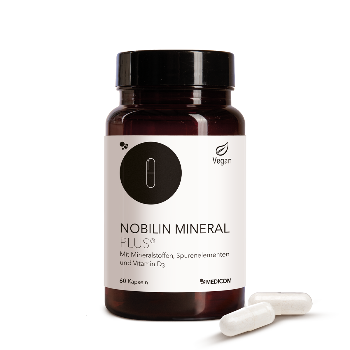 Die Produktdose von Nobilin Mineral Plus® und zwei Kapseln vor der Produktdose.