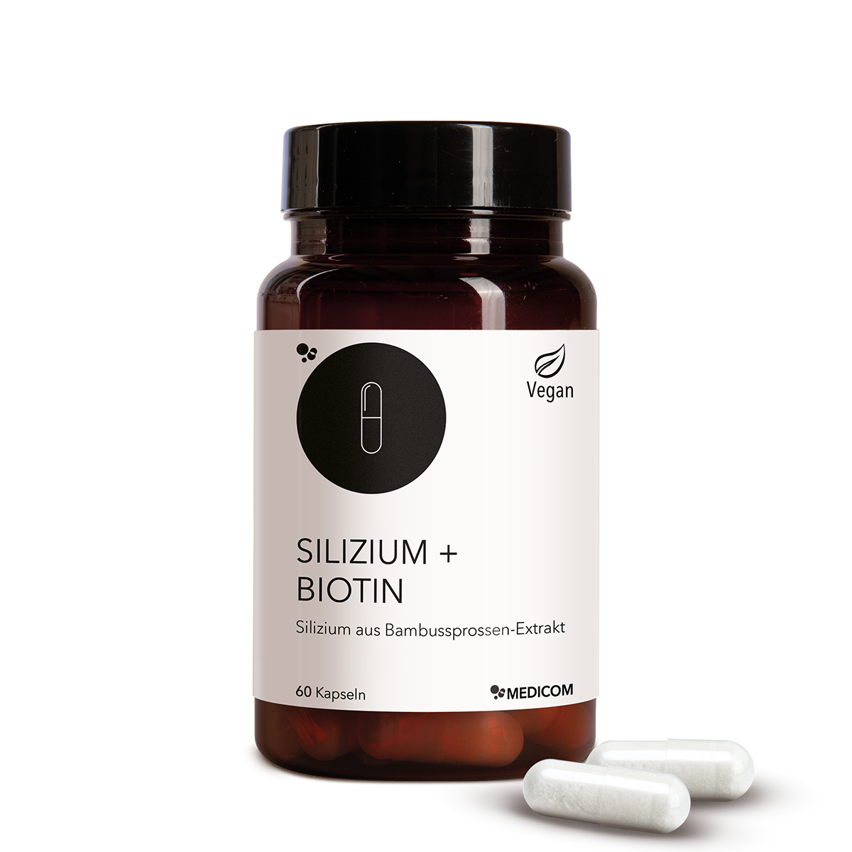 Die Produktdose von Silizium + Biotin in der Vorderansicht und zwei Kapseln vor der Produktdose