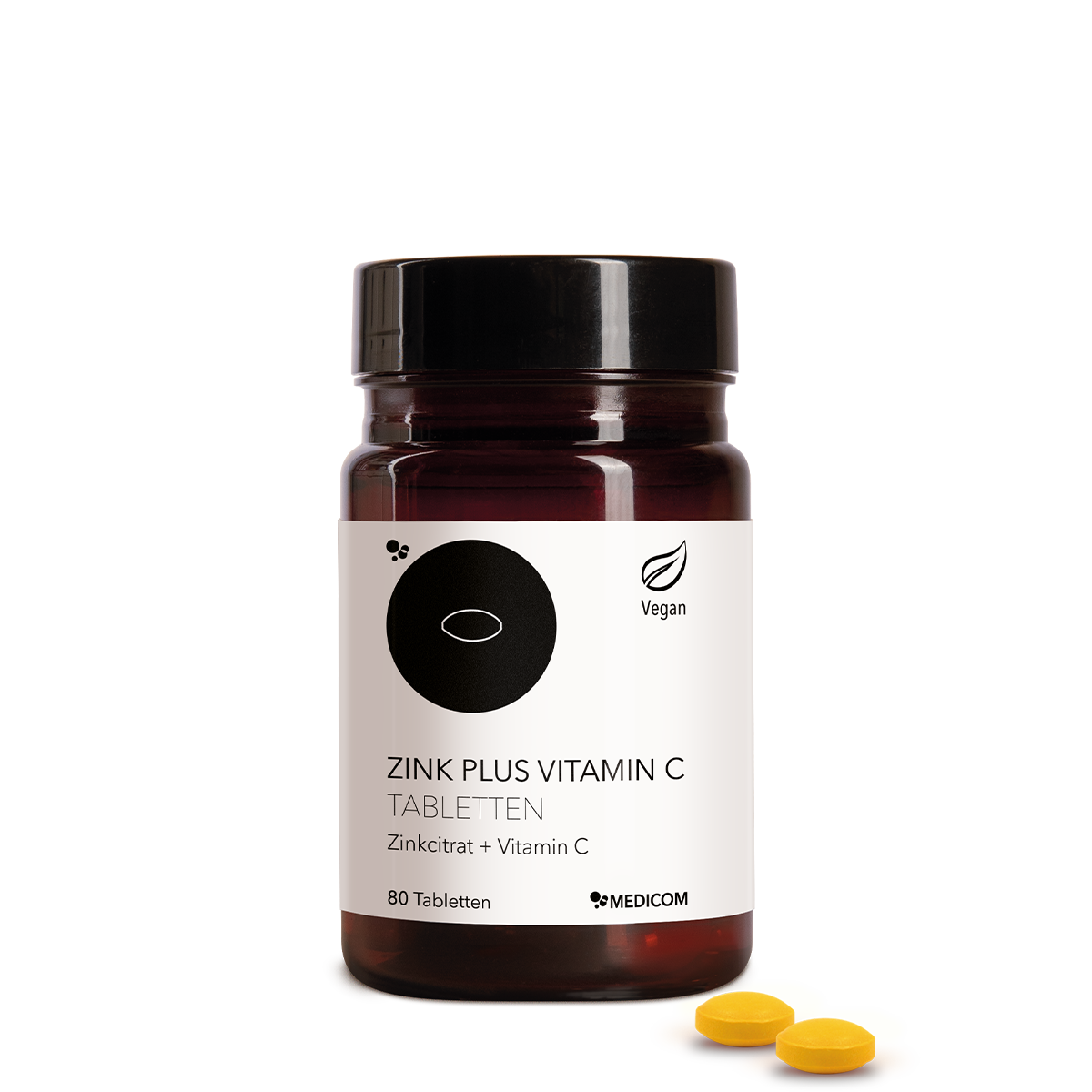 Die Zink Plus Vitamin C Tabletten in der stilvollen Produktdose von Medicom – Zinkcitrat und Vitamin C. Zwei Tabletten im Vordergrund
