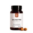 Eine Flasche mit der Aufschrift Median Gelenk Pro von Medicom und drei braune Kapseln mit Curcumin-Konzentrat sind auf weißem Hintergrund zu sehen.