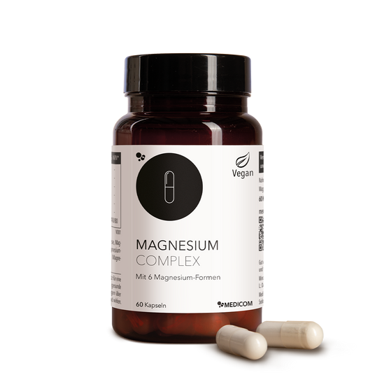 Braune Flasche mit der Aufschrift Magnesium Complex und zwei Kapseln daneben, gekennzeichnet als vegan, 60 Kapseln.