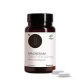 Produkt Magnesium Tablette 200 mg von Medicom in der Vorderansicht. 2 Tabletten des Produktes im Vordergrund.