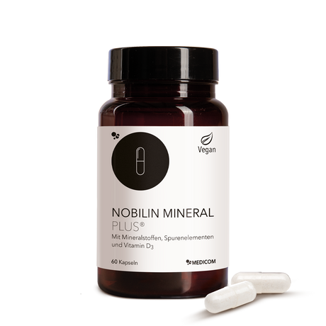 Die Produktdose von Nobilin Mineral Plus® und zwei Kapseln vor der Produktdose.