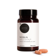Nobilin Multvital® ­­ - die Vorderansicht der Produktdose mit zwei Tabletten im Vordergrund