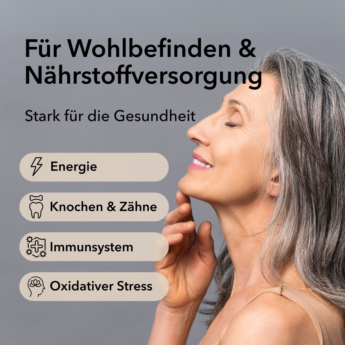 Produktinformationen zu Nobilin Multivital® mit Anwendungsgebieten: Energie, Knochen & Zähne, Immunsystem, oxidativer Stress. Eine Frau mittleren Alters in der Seitenansicht mit geschlossenen Augen und einem Lächeln im Gesicht.