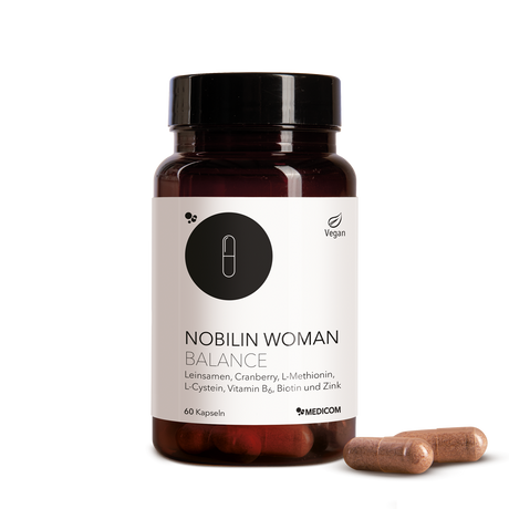 Die Produktdose von Nobilin Woman Balance mit zwei Kapseln im Vordergrund