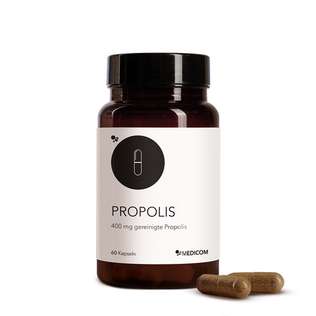 A brown bottle labeled "Propolis" with 400 mg and two Propolis capsules beside it on a white background, highlighting this valuable natural product.